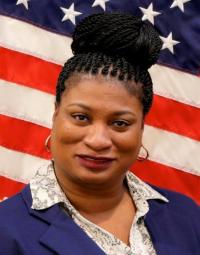 photo of Wanda Wheatley in front of an American flag